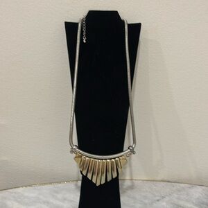 Silver and gold coloured necklace.